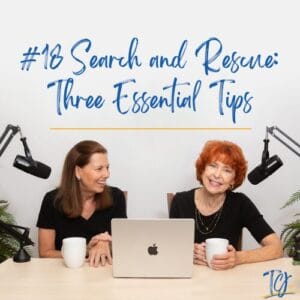 Two women sharing tips on search and rescue with laptops and coffee.